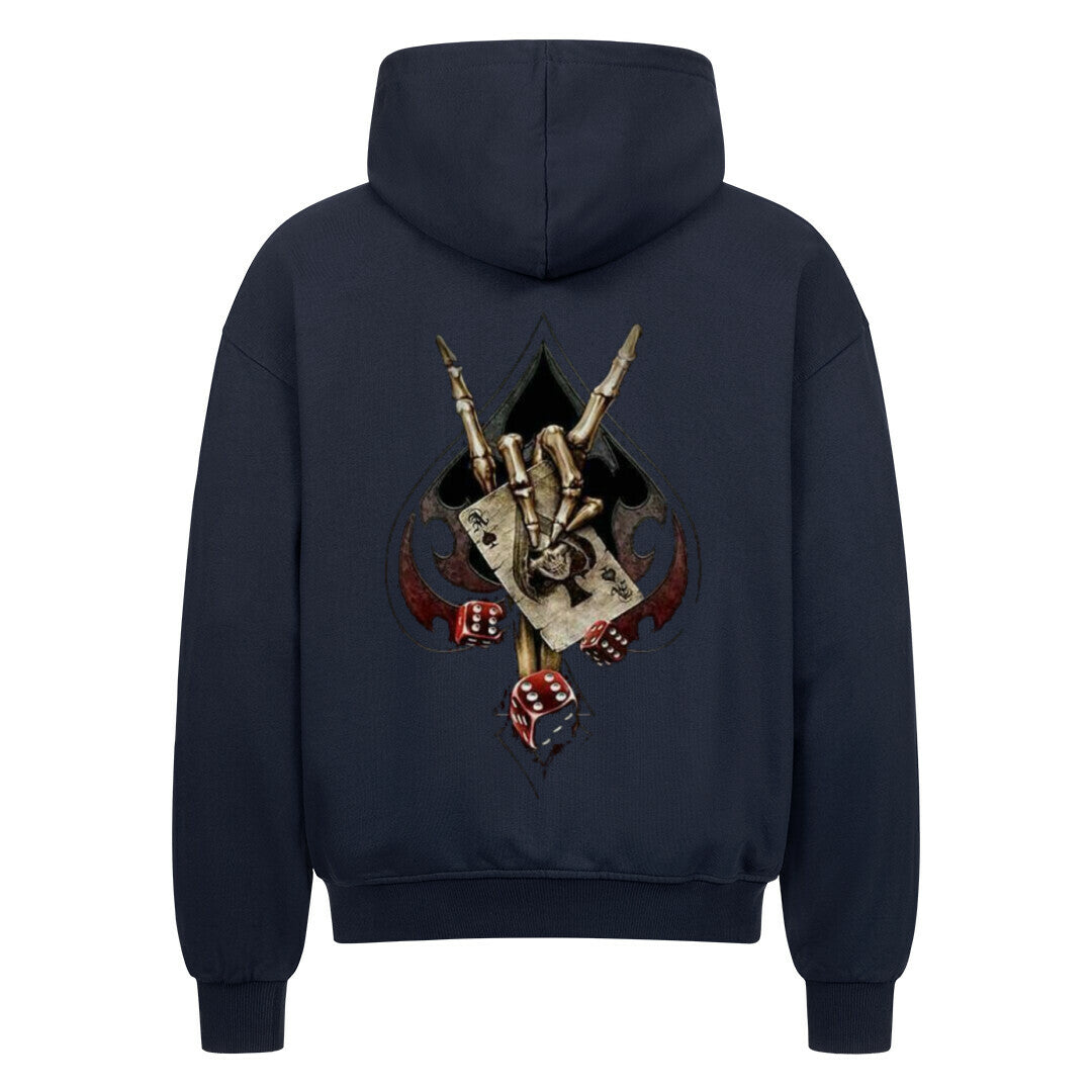 Back view of a french navy hoodie featuring a bold biker-themed backprint with a skeletal hand throwing the horns, playing cards, dice, and spade symbol – worn by rebellious streetwear fans.
