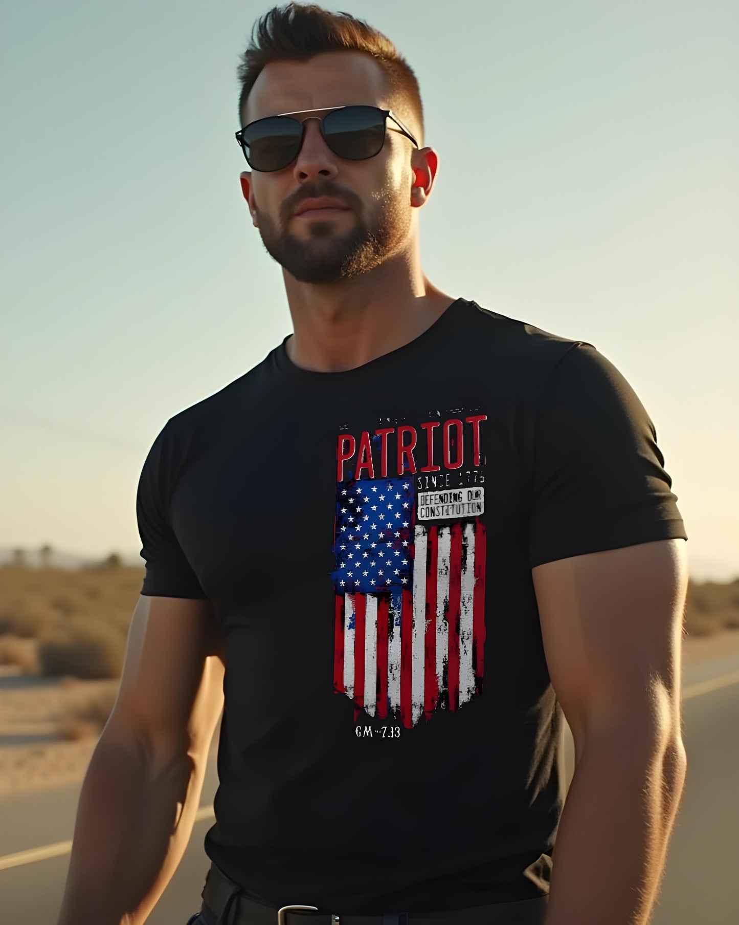 Black T-shirt with a distressed American flag graphic and red "Patriot" text, featuring the phrases "Since 1776" and "Defending our Constitution" alongside GM–7.13 branding.

