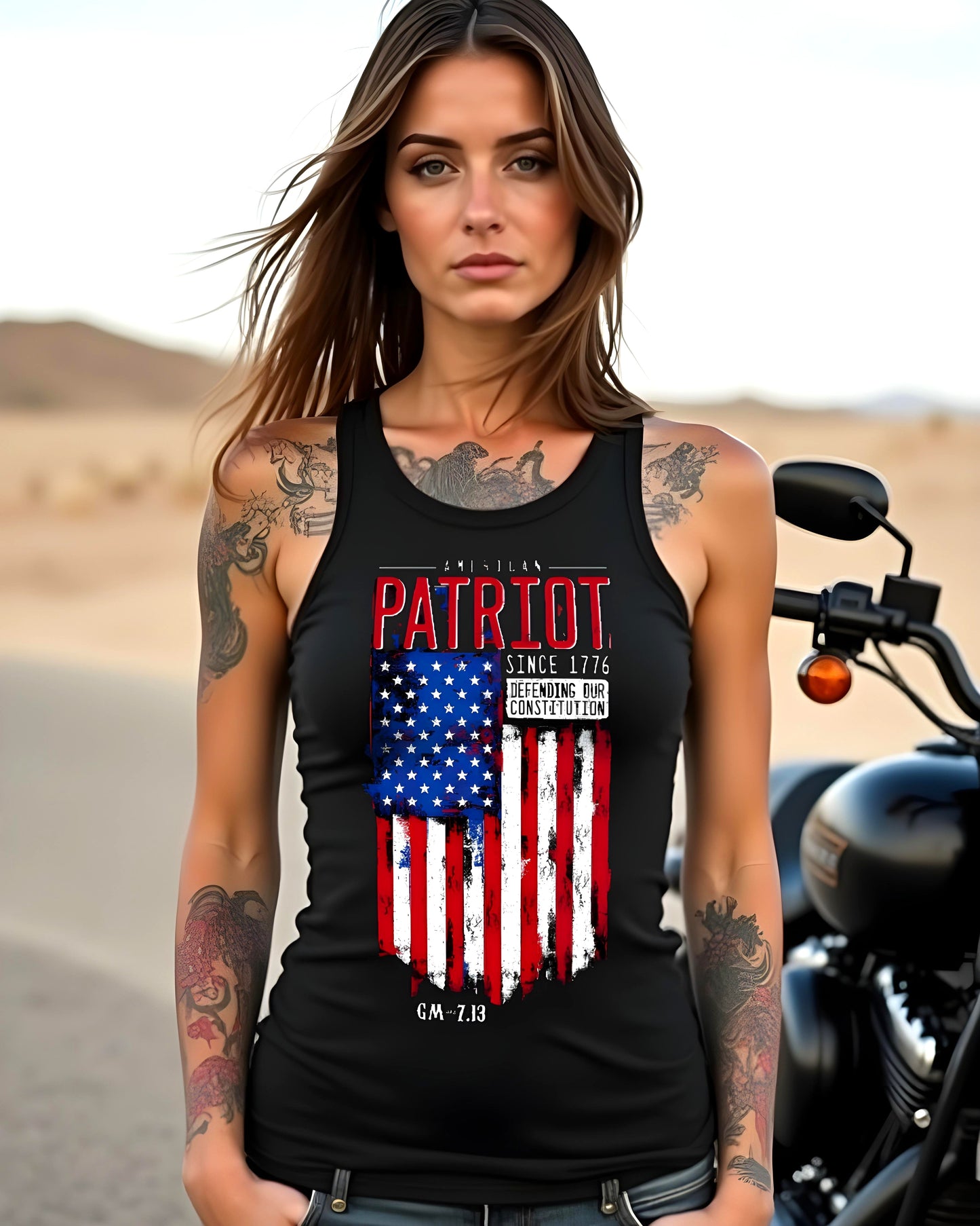 Women's black tank top featuring a distressed American flag design with bold red "PATRIOT" text, and the slogans "Since 1776" and "Defending Our Constitution" along with GM–7.13 branding.
